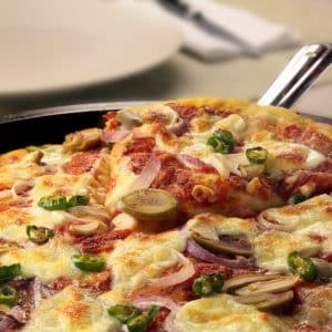 Pizza with mozzarella, red onion, olives and chilis