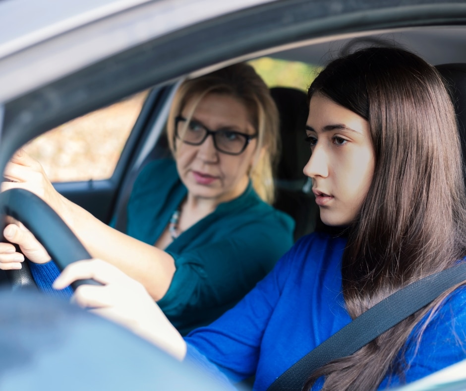 driving instructor Photo of a driving instructor teaching a teenage girl how to drive, possibly in Solihull