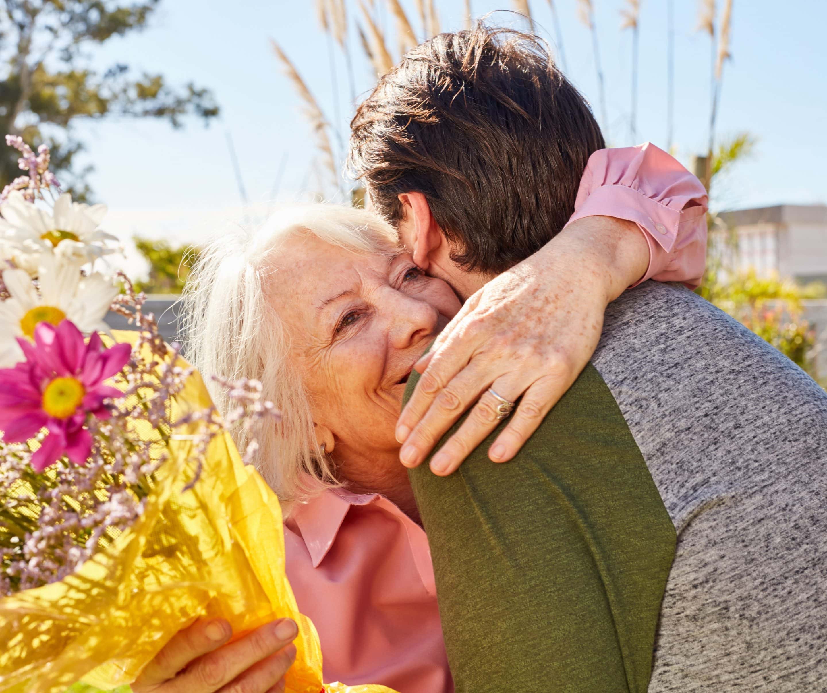 mothers day photo of mum and son embracing