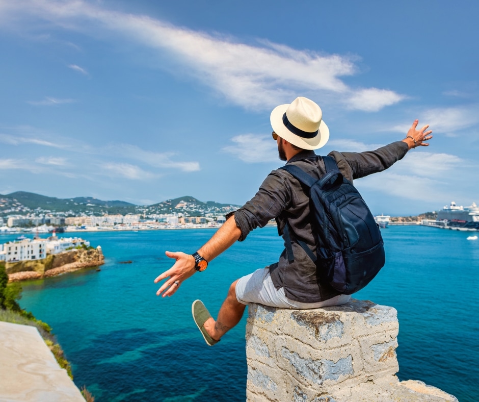 photo of man looking out to sea on holiday