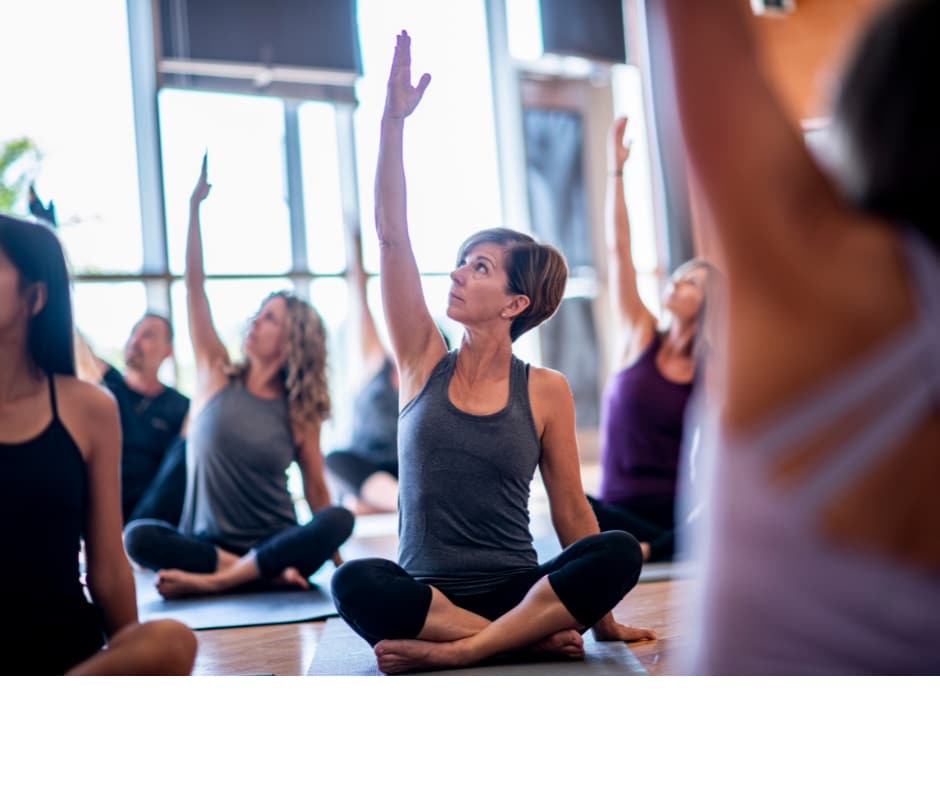 Photo of people in a yoga class