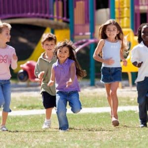 kids running through a park
